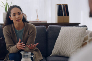 woman guided by a therapist during CBT addiction treatment