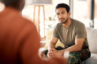 man speaking with his therapist during individual cognitive behavioral therapy