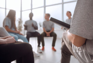 Group of adults talking together in an intensive outpatient therapy session