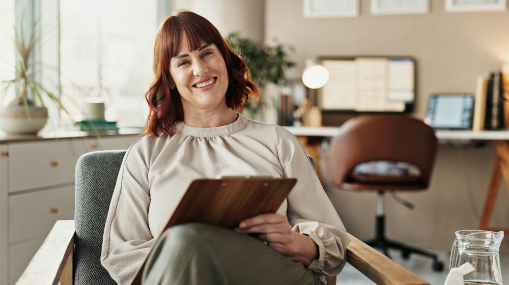 Smiling counselor welcoming clients to opioid addiction therapy