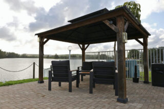 Peaceful lakeside gazebo offering a calm setting for PTSD and addiction treatment